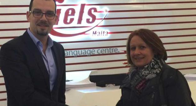 Marthese Mugliett, on behalf of the Downs Syndrome Association Malta, received the donation from Alex Lanczet, IELS general manager