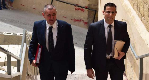 Whistleblower Joe Cauchi (left) entering the Gozo Court, accompanied by his lawyer Robert Abela