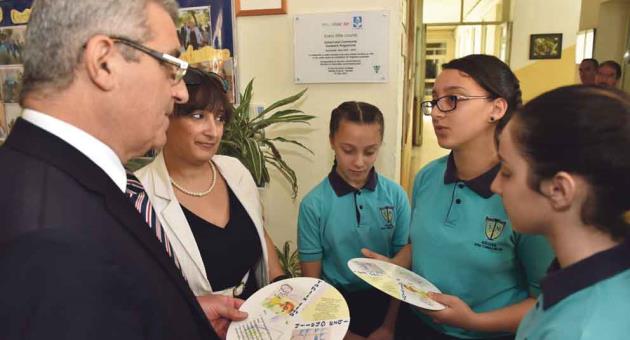 Minister Bartolo receiving the water conservation cards designed by students of St Thomas More Middle School Tarxien