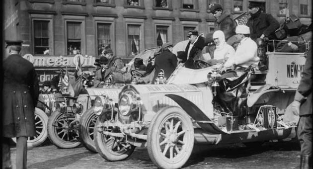 The 1908 New York to Paris Race: Cars lined up for the start. In this photo from right to left: De Dion-Bouton (in front), Protos, Motobloc