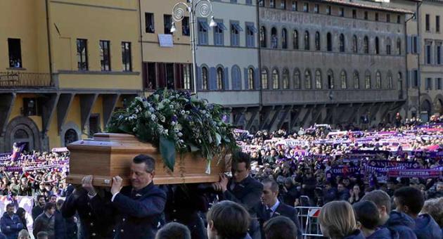 The coffin is carried into the church during the funeral ceremony of Italian player Davide Astori in Florence, Italy, Thursday, March 8, 2018. The 31-year-old Astori was found dead in his hotel room on Sunday after a suspected cardiac arrest before his team was set to play an Italian league match at Udinese. (AP Photo/Alessandra Tarantino)