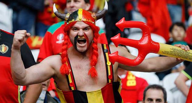 In this Friday, July 1, 2016 file photo, a Belgium fan poses for a photograph prior to the Euro 2016 quarterfinal soccer match between Wales and Belgium, at the Pierre Mauroy stadium in Villeneuve d'Ascq, near Lille, France. The Belgian football federation said on Thursday, March 8, 2018 that it will not change its mind about choosing a rapper known for lacing his songs with obscene and misogynistic lyrics to produce its official World Cup song. (AP Photo/Frank Augstein, File)