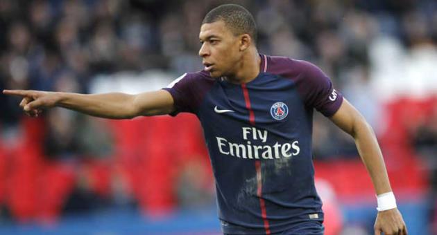 PSG's Kylian Mbappe celebrates his side's second goal during the French League One soccer match between Paris Saint-Germain and Angers at the Parc des Princes Stadium, in Paris, France, Wednesday, March 14, 2018. (AP Photo/Christophe Ena)