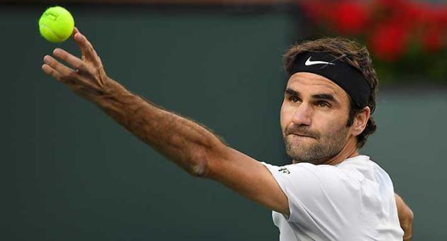 Roger Federer, of Switzerland, serves to Jeremy Chardy, of France, at the BNP Paribas Open tennis tournament Wednesday, March 14, 2018, in Indian Wells, Calif. (AP Photo/Mark J. Terrill)