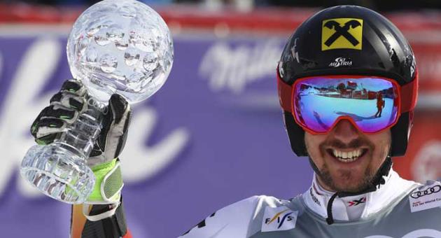 Austria's Marcel Hirscher holds the men's World Cup giant slalom discipline trophy, at the alpine ski World Cup finals in Are, Sweden, Saturday, March 17, 2018. (AP Photo/Marco Trovati)