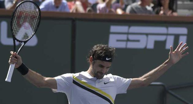 Roger Federer, of Switzerland, celebrates after beating Borna Coric, of Croatia, during the semifinals at the BNP Paribas Open tennis tournament, Saturday, March 17, 2018, in Indian Wells, Calif. (AP Photo/Mark J. Terrill)