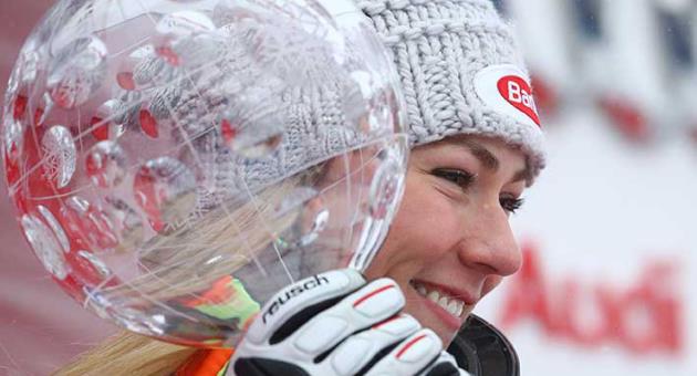 United States's Mikaela Shiffrin holds the women's World Cup overall trophy, at the alpine ski World Cup finals in Are, Sweden, Sunday, March 18, 2018. (AP Photo/Alessandro Trovati)