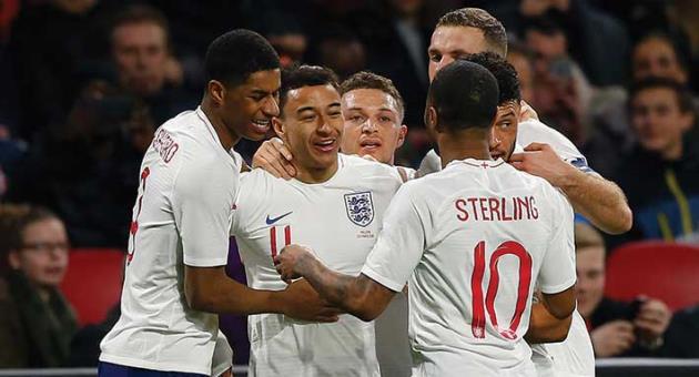 England's Jesse Lingard, second left, celebrates scoring his side's first goal during the international friendly soccer match between the Netherlands and England at the Amsterdam ArenA in Amsterdam, Netherlands, Friday, March 23, 2018. (AP Photo/Peter Dejong)