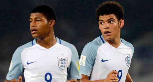In this Wednesday, Oct. 25, 2017 file photo, England's Morgan Gibbs White, right, and Rhian Brewster follow the ball during the FIFA U-17 World Cup semifinal match against Brazil in Kolkata, India. FIFA on Thursday, April 19, 2018 has closed a racism investigation that involved a Spain player and an England opponent from the Under-17 World Cup final. FIFA says its disciplinary panel dismissed the charge against the Spanish player because of a “lack of sufficient evidence that could corroborate the English player’s claim.” England striker Rhian Brewster reported overhearing teammate Morgan Gibbs-White being called a “monkey” during the team’s 5-2 win over Spain in India last October. (AP Photo/Bikas Das, file)