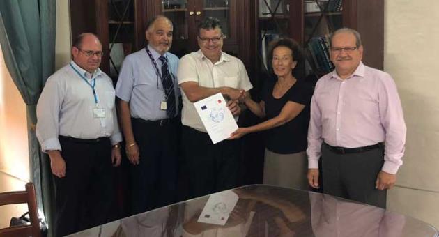 Diana Cassar, Managing Director of C&C Express Ltd receiving the AEOF certification from Joseph Chetcuti, Director General at Customs in the presence of Francis Callus, Inspector of Customs and AEO Contact Point, John Azzopardi, QA Manager at C&C Express and Paul Bonello, Advisor Customs Procedures & AEO Programme.