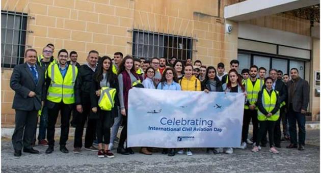 Students and lecturers from MCAST’S Aviation Centre celebrating World Aviation Day at MEDAVIA.