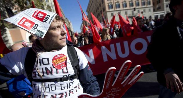 CGIL union workers union march during a demonstration to protest Premier Matteo Renzi's labor reforms, in Rome, Saturday