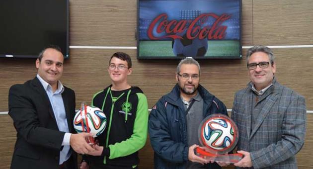 The ball in his court: ‘Kontrattakk’ presenter Sandro Micallef (left) having a go at the mythical World Cup 2014 ball with GSD Marketing Ltd head of Marketing Albert Gouder (right) in the presence of the two winners, Alexander Gauci and Ryan Cassar