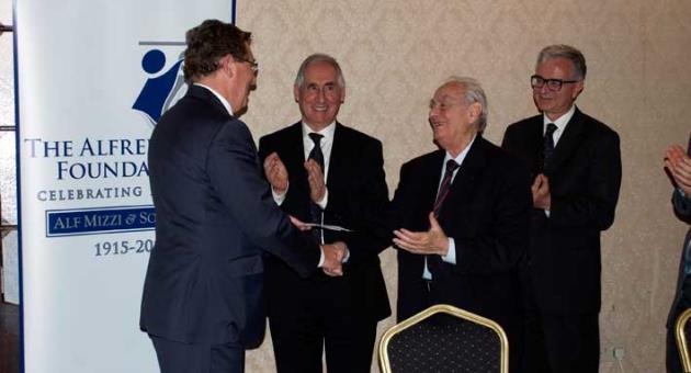 Julian Sammut, first from left , Trustee of The Alfred Miizzi Foundation, presenting the sponsorship to Dr. Albert Ganado, President of the Malta Map Society, third from left.