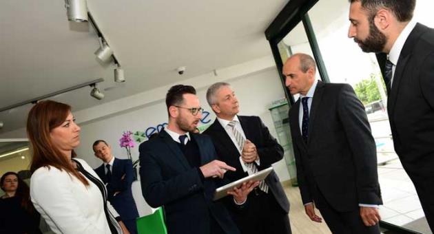 Adam Bugeja, emcare product manager displaying features of myemCare application to Ivan Bartolo and Minister Fearne. Also in the picture Lucienne Bezzina, emCare Operations, Sales and customer experience manager and Roland Cachia, emcare General Manager.   