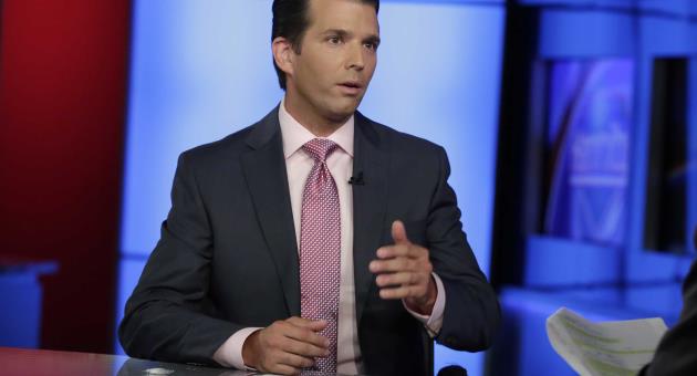 In this photo taken July 11, 2017, Donald Trump Jr. is interviewed by host Sean Hannity on his Fox News Channel television program, in New York. 