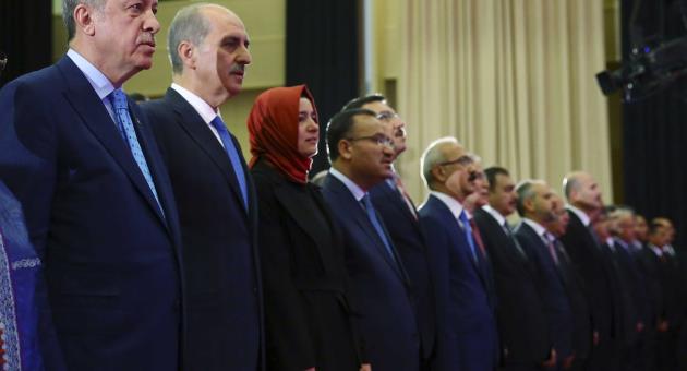 Turkey's President Recep Tayyip Erdogan, left, attends a ceremony marking the July 15, 2016 failed coup attempt anniversary, in Ankara, Turkey, Friday, July 14, 2017