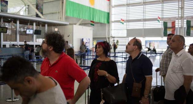 Travelers line up to check in at the Irbil International Airport, in Iraq, Friday, Sept. 29, 2017. Many travelers boarded the last flights out of the cities of Irbil and Sulaymaniyah as an Iraqi government order to halt all international flights in Kurdish territory was set to kick in on Friday. 