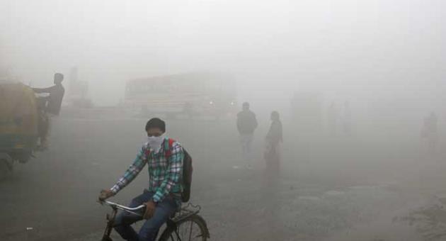 Indian commuters wait for transport amid thick blanket of smog on the outskirts of New Delhi, India, Friday, Nov. 10, 2017. As air pollution peaked this week in Delhi, it rose to more than 30 times the World Health Organization’s recommended safe level. 
