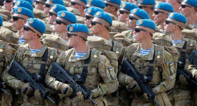 This Aug. 24, 2017, file photo shows Ukrainian soldiers marching along main Khreshchatyk Street during a military parade to celebrate Independence Day in Kiev, Ukraine. 