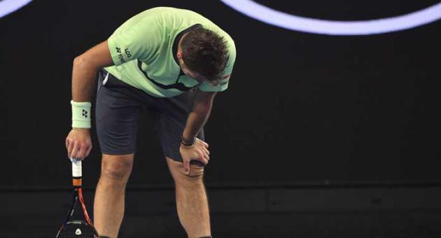 In this Jan. 18, 2018, file photo, Switzerland's Stan Wawrinka bends over during his second round match against United States' Tennys Sandgren at the Australian Open tennis championships in Melbourne, Australia.