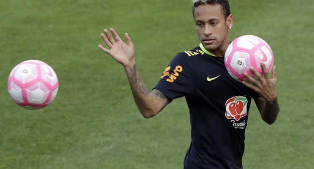 In this Friday, Oct. 6, 2017 file photo, Brazil's Neymar attends a training session in preparation for an upcoming World Cup qualifying match, in Sao Paulo, Brazil. Neymar will have surgery on a fractured toe in his right foot and could be out for up to three months, an estimate that would take the Brazil striker right up to the World Cup. Neymar was injured Sunday, Feb. 25, 2018 in Paris Saint-Germain's match against Marseille in the French league. (AP Photo/Andre Penner, file)