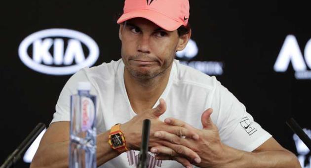 In this Jan. 23, 2018, file photo, Spain's Rafael Nadal answers questions at a press conference after retiring injured from his quarterfinal against Croatia's Marin Cilic at the Australian Open tennis championships in Melbourne, Australia. Rafael Nadal will miss the upcoming Indian Wells and Miami tournaments because of a lingering right hip injury. Nadal made the announcement Friday, March 2, 2018, on Facebook. (AP Photo/Mark Baker, File)