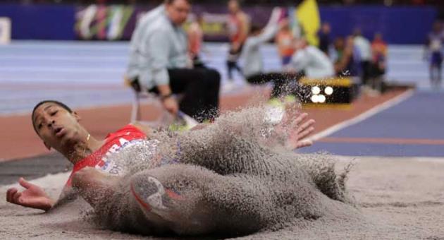 Cuba's Juan Miguel Echevarria makes an attempt in the men's long jump final at the World Athletics Indoor Championships in Birmingham, Britain, Friday, March 2, 2018. (AP Photo/Matt Dunham)
