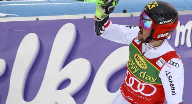 Austria's Marcel Hirscher celebrates in the finish area after winning an alpine ski, men's World Cup giant slalom in Kranjska Gora, Slovenia, Saturday, March 3, 2018. (AP Photo/Alessandro Trovati)