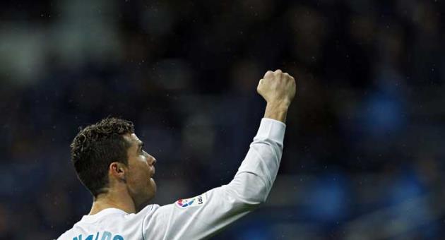 Real Madrid's Cristiano Ronaldo celebrates after scoring his side's second goal against Getafe during the Spanish La Liga soccer match between Real Madrid and Getafe at the Santiago Bernabeu stadium in Madrid, Saturday, March 3, 2018. (AP Photo/Francisco Seco)