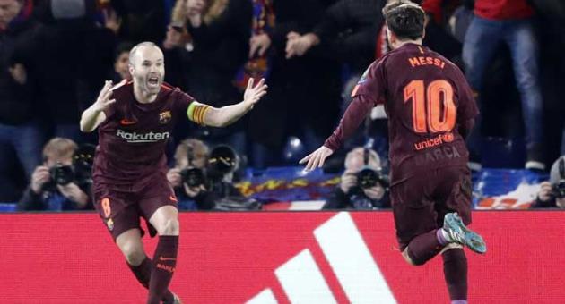 Barcelona's Lionel Messi, right, and his teammate Andres Iniesta celebrate the goal of their team during the Champions League, round of 16, first-leg soccer match between Chelsea and Barcelona at Stamford Bridge stadium, Tuesday, Feb. 20, 2018. (AP Photo/Frank Augstein)