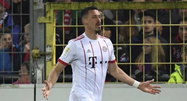 Munich's Sandro Wagner celebrates his side's third goal during the German Bundesliga soccer match between SC Freiburg and Bayern Munich, in Freiburg, Germany, Sunday, March 4, 2018. (Patrick Seeger/dpa via AP)
