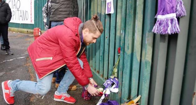 Supporters lay flowers and scarves to pay their homage to Davide Astori, outside the Artemio Franchi stadium, in Florence, Italy, Sunday, March 4, 2018. Fiorentina captain Davide Astori was found dead in his hotel room on Sunday at the age of 31 after a suspected cardiac arrest before an Italian league match. The defender, who has also played 14 times for Italy’s national team, was discovered by Fiorentina staff when he failed to show up for breakfast at the hotel in Udine. Fiorentina’s game at Udinese in northeast Italy was called off, along with all fixtures in the country’s top two divisions. (Maurizio Degl'Innocenti/ANSA via AP)