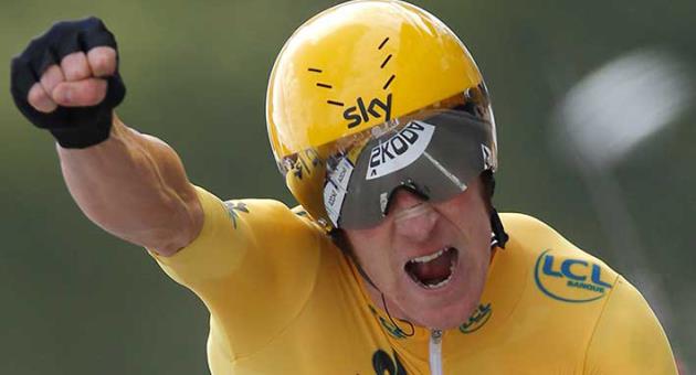 In this July 21, 2012 file photo, Bradley Wiggins of Britain, wearing the overall leader's yellow jersey, celebrates as he crosses the finish line of the 19th stage of the the Tour de France cycling race in Chartres, France. A British parliamentary committee says in a doping investigation report that Bradley Wiggins used a banned powerful corticosteroid to enhance his performance and not for medical reasons while winning the Tour de France in 2012. The report accuses Team Sky of crossing an “ethical line” after preaching zero tolerance. Team Sky criticized “the anonymous and potentially malicious claim” by members of parliament. (AP Photo/Laurent Rebours, File)