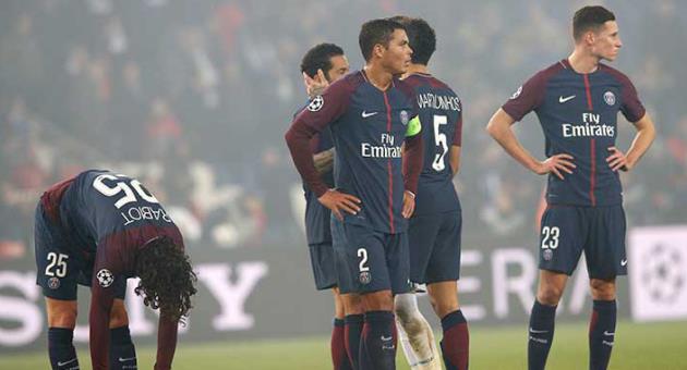 PSG players react to losing the Champions League round of sixteen second leg soccer match between Paris St. Germain and Real Madrid at the Parc des Princes stadium in Paris, France, Tuesday, March 6, 2018. (AP Photo/Christophe Ena)