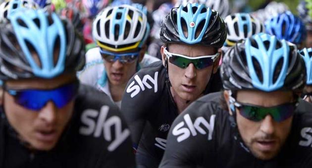 In this Tuesday, May 14, 2013 file photo Britain's Bradley Wiggins, second from right, pedals during the the 10th stage of the Giro d'Italia, Tour of Italy cycling race, from Cordenons to Altopiano del Montasio. A British parliamentary committee says in a doping investigation report that Bradley Wiggins used a banned powerful corticosteroid to enhance his performance and not for medical reasons while winning the Tour de France in 2012. The report accuses Team Sky of crossing an 