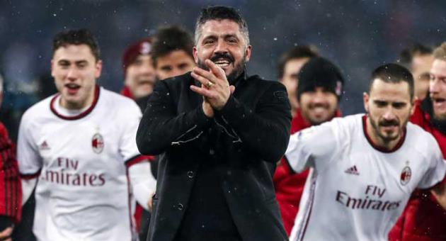 AC Milan coach Gennaro Gattuso celebrates with players after winning the Italian Cup, second-leg semifinal soccer match between Lazio and AC Milan, at the Rome Olympic stadium Wednesday, Feb. 28, 2018. AC Milan won 5-4 following a penalty shootout and advances to the final where it plays Juventus. (Angelo Carconi/ANSA via AP)
