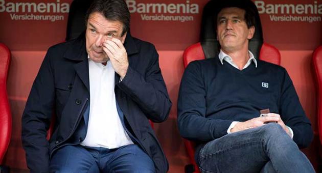 In this Sept. 24, 2017 file photo Hamburg's chairman Heribert Bruchhagen, left, and sports director Jens Todt attend the Bundesliga soccer match between Bayer Leverkusen and Hamburger SV in Leverkusen, Germany. Relegation-threatened Hamburger SV has sacked chairman Heribert Bruchhagen and sporting director Jens Todt Thursday, March 8, 2018. (Marius Becker/dpa via AP,file)