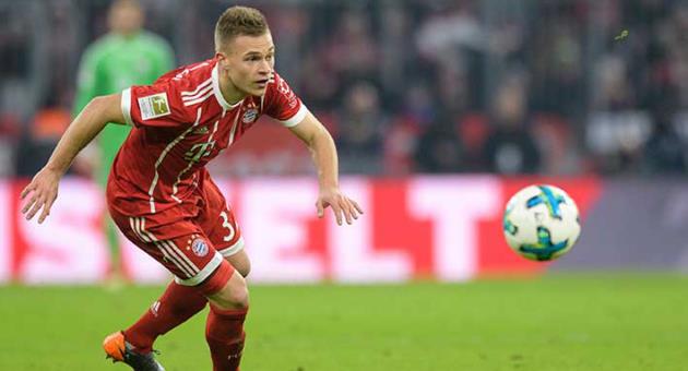 In this Feb. 10, 2018 file photo Bayern's Joshua Kimmich follows the ball in a Bundesliga match against Schalke in Munich, southern Germany. Germany midfielder Joshua Kimmich has extended his contract with Bayern Munich by three years through June 2023. (Matthias Balk/dpa via AP)