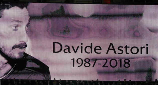 An image of Fiorentina captain Davide Astori is projected on a giant screen prior to the Champions League, round of 16, second-leg soccer match between Juventus and Tottenham Hotspur, at the Wembley Stadium in London, Wednesday, March 7, 2018. Fiorentina captain Davide Astori was found dead in his hotel room on Sunday at the age of 31 after a suspected cardiac arrest before an Italian league match. (AP Photo/Kirsty Wigglesworth)