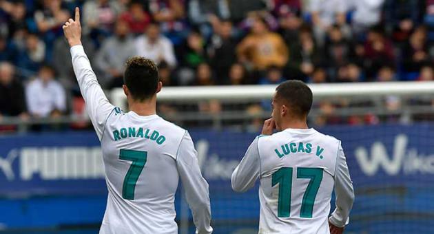 Real Madrid's Cristiano Ronaldo celebrates his second goal beside Lucas Vazquez after scoring during the Spanish La Liga soccer match between Real Madrid and SD Eibar at Ipurua stadium, in Eibar, northern Spain, Saturday, March 10, 2018. (AP Photo/Alvaro Barrientos)