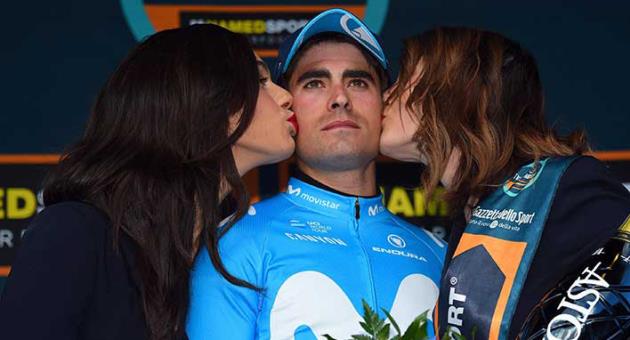 Spain's Mikel Landa receives the kiss of the race hostesses after winning the 4th stage of the Tirreno-Adriatico cycling race, from Foligno to Sassotetto, Italy, Saturday, March 10, 2018. (Dario Belingheri/ANSA via AP)