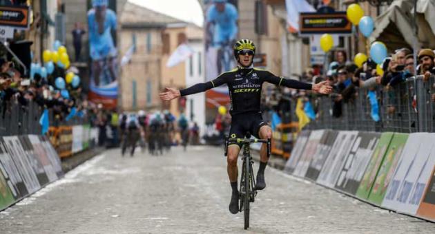 Britain's Adam Yates celebrates as he crosses the finish line to win the 5th stage of the Tirreno-Adriatico cycling race, from Castelraimondo to Filottrano, Italy, Sunday, March 11, 2018. (Dario Belingheri/ANSA via AP)