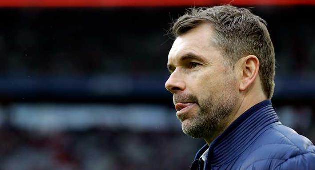 In this March 10, 2018 photo Hamburg coach Bernd Hollerbach arrives for the German Soccer Bundesliga match between FC Bayern Munich and Hamburger SV in Munich, Germany. (AP Photo/Matthias Schrader, file)