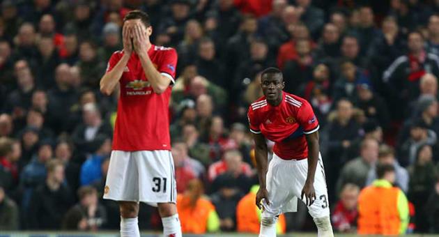 Manchester United's Nemanja Matic reacts after Sevilla scored their second goal of the game as he waits for the restart during the Champions League round of 16 second leg soccer match between Manchester United and Sevilla, at Old Trafford in Manchester, England, Tuesday, March 13, 2018. (AP Photo/Dave Thompson)