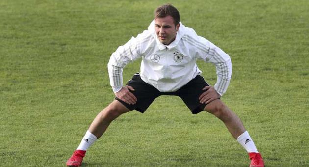 In this Nov. 8, 2017 file photo, German national soccer player Mario Goetze stretches during a training session of the German national soccer team in Berlin. Germany coach Joachim Loew made no new call-ups on Friday March 16, 2018 for the side’s upcoming friendly games against Spain and Brazil, for which Mario Goetze and Marco Reus were left out. (AP Photo/Michael Sohn)