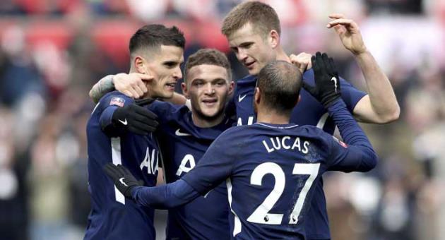 Tottenham Hotspur's Erik Lamela, left, celebrates scoring his side's second goal of the game against Swansea City with teammates during the English FA Cup, quarterfinal soccer match at the Liberty Stadium, Swansea, Wales, Saturday March 17, 2018. (Nick Potts/PA via AP)