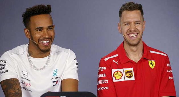 Mercedes driver Lewis Hamilton of Britain and Ferrari driver Sebastian Vettel of Germany, right, laugh during a drivers' press conference at the Australian Formula One Grand Prix in Melbourne, Thursday, March 22, 2018. The first race of the 2018 seasons is on Sunday. (AP Photo/Rick Rycroft)