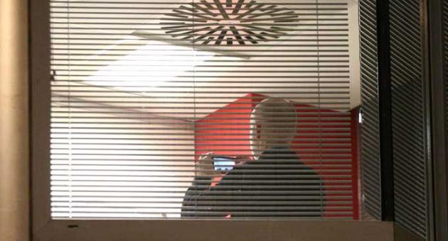 Information Commissioner's Office enforcement officers work inside the offices of Cambridge Analytica in central London after a High Court judge granted a search warrant, Friday March 23, 2018. 