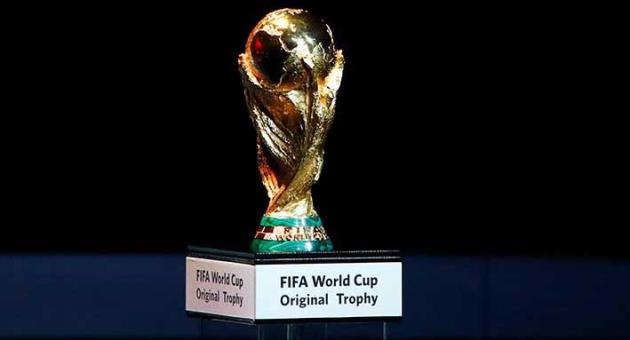 A Friday Dec. 1, 2017 file photo of the World Cup trophy placed on display during the 2018 soccer World Cup draw in the Kremlin in Moscow. Morocco has touted its limited threat from gun crime in a 2026 World Cup bidding proposal to take on the United States-led rival for the 2026 soccer showpiece. The North African nation highlights safety for visiting fans in bidding documents published by FIFA on Monday that do however show every stadium and training ground requires building work. (AP Photo/Pavel Golovkin, File)